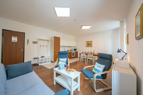 Family Apartment, 3 Bedrooms, 2 Bathrooms (Residenza Rocca Del Lago 4) | Living area | 21-inch flat-screen TV with cable channels