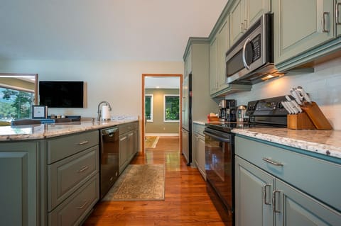 Kitchen is outfitted w/ Electric Smooth-top Range