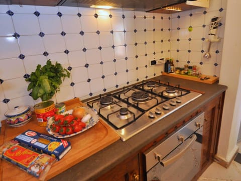 Villa | Private kitchen | Cookware/dishes/utensils, dining tables