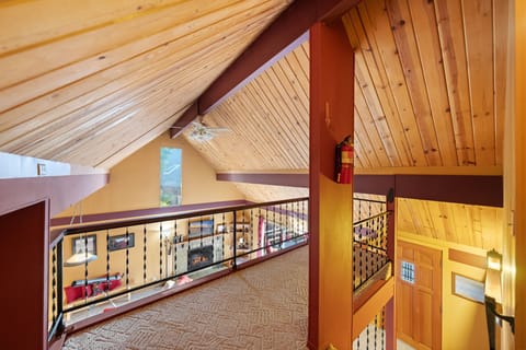 The home features stunning vaulted ceilings adorned with rustic - The home features stunning vaulted ceilings adorned with rustic knotty pine.