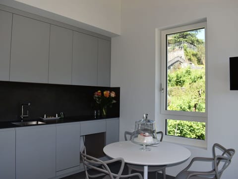 Furniture, Property, Comfort, Table, Azure, Plant, Building, Wood, Textile