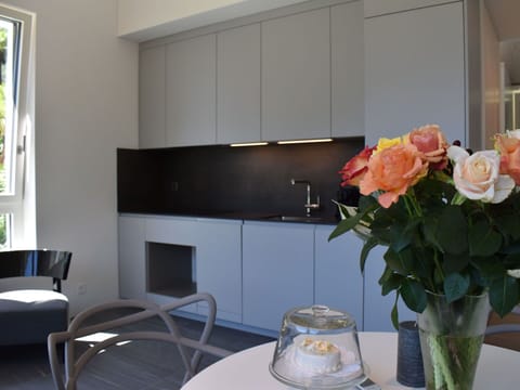 Flower, Furniture, Table, Plant, Building, Orange, Window, Interior Design, Chair, Vase