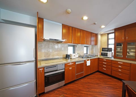 Luxury Condo | Private kitchen | Full-size fridge, microwave, oven, stovetop