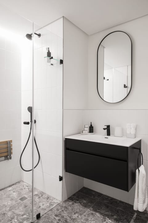 Superior Studio | Bathroom | Shower, designer toiletries, hair dryer, soap