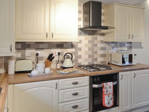 Modern fitted kitchen | Ysgubor Myfi - Trehwfa Cottages, Bodedern, near Holyhead