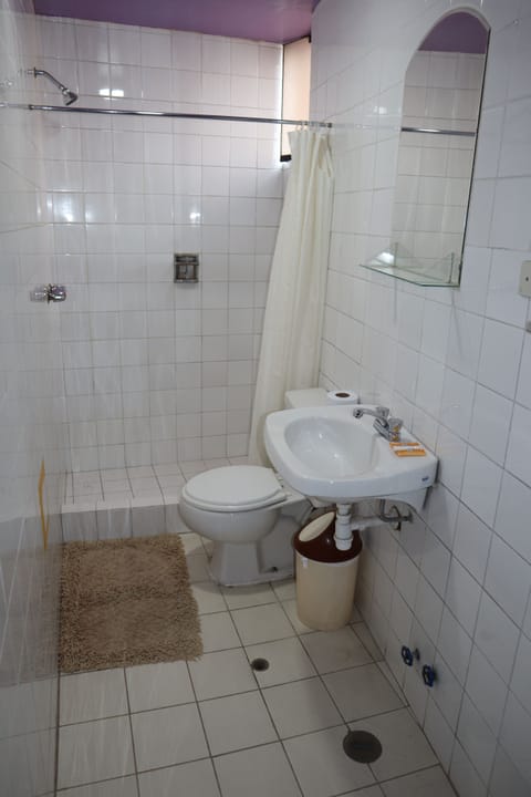 Comfort Quadruple Room, 1 Bedroom | Bathroom | Combined shower/tub, rainfall showerhead, towels, soap