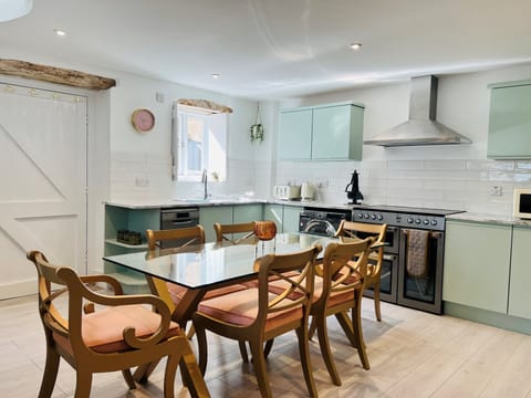 The kitchen with dining table that can sit up to 8.