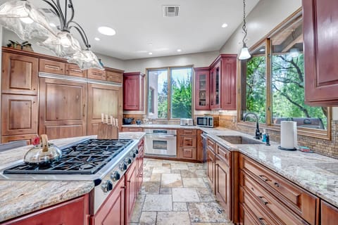 Open Kitchen Area with 6-Burner Gas Stove