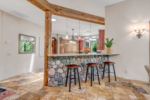Bar Top Seating for Three into Open Kitchen Area