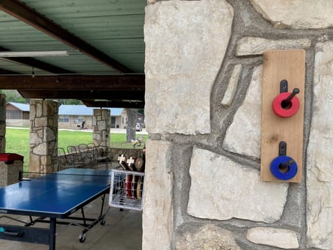 pavilion with ping pong table. red & blue washers