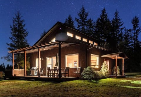 Enjoy the sunset over Olympic National Park from the hot tub or back porch.