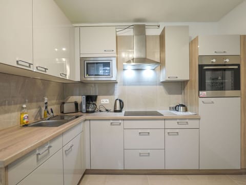 Countertop, Cabinetry, Kitchen Sink, Sink, Furniture, Tap, Building, Kitchen Stove, Drawer, Wood