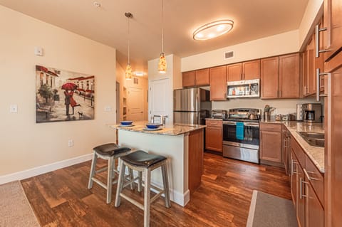 Deluxe Apartment | Private kitchen | Dining tables