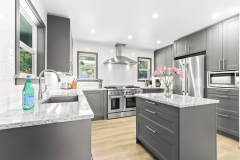 A fully remodeled chef's kitchen that is both beautiful, practical, and ready 4U
