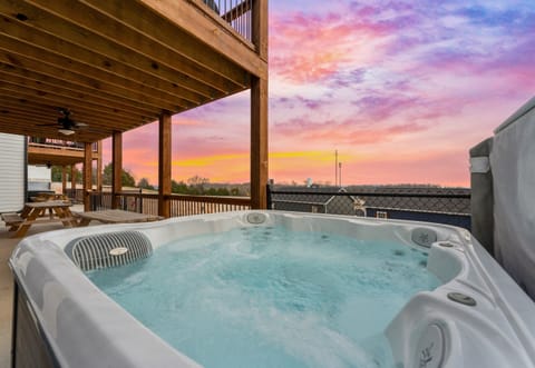 Enjoy a relaxing soak in the hot tub while taking in the stunning sunset views—a perfect end to any day.