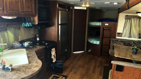 Deluxe Mobile Home, 1 Bedroom | Private kitchen | Microwave, cookware/dishes/utensils, paper towels, dining tables