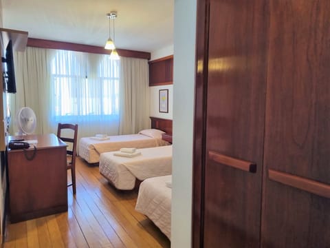 Economy Triple Room, 3 Twin Beds | Minibar, desk, laptop workspace, free WiFi