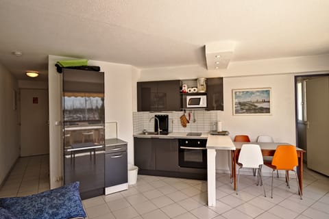 Apartment, 2 Bedrooms | Private kitchen | Fridge, microwave, stovetop, coffee/tea maker