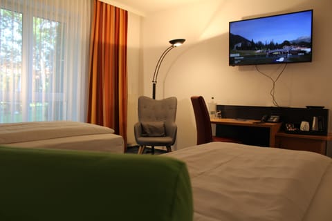 Superior Twin Room | Living area | 55-inch LCD TV with satellite channels, TV