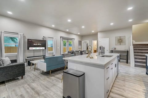 Our Rental Features an Open Layout Design, where the Kitchen, Living Room, and Dining Area Harmoniously Coexist, Offering Seamless Flow and Easy Living