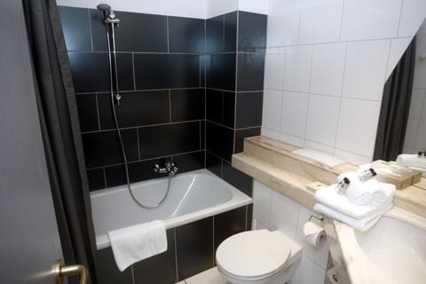 Combined shower/tub, free toiletries, hair dryer, slippers