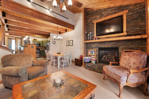 Warm woods around a cozy living room, open right to the kitchen and dining, inviting for family and friends!