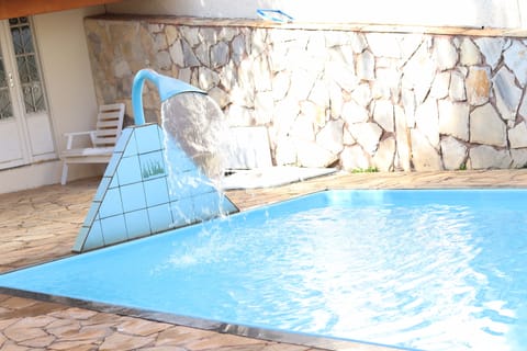 Outdoor pool, open 8:00 AM to 8:00 PM, pool umbrellas, sun loungers