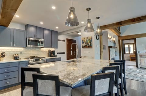 A nicely updated kitchen with plenty of bar stool seating around the island.