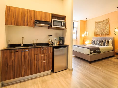 Studio Suite, 1 Queen Bed, Pool Access, City View | Private kitchen | Microwave, coffee/tea maker, blender, cleaning supplies