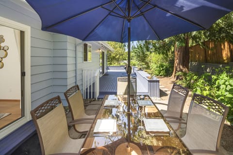 Outdoor entertainment area with a table for six. 