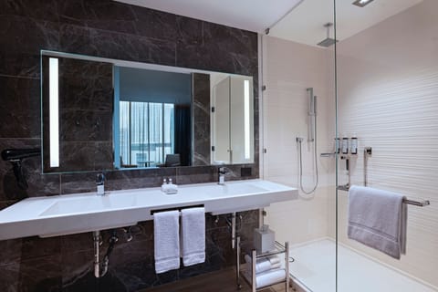 Junior Suite, 1 King Bed | Bathroom | Shower, hair dryer, bathrobes, towels