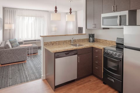 Suite, 2 Bedrooms | Private kitchen | Fridge, microwave, stovetop, dishwasher