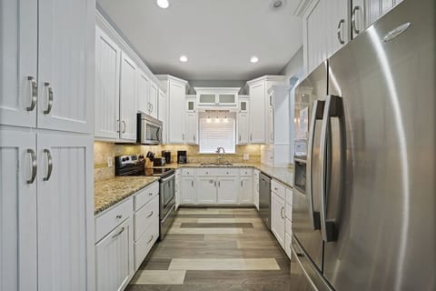 Flirty Flamingo - Pet-Friendly Vacation Rental House Near Beach with Game Room, Private Pool, & Carriage House in Crystal Beach, Florida - Five Star Properties Destin/30A