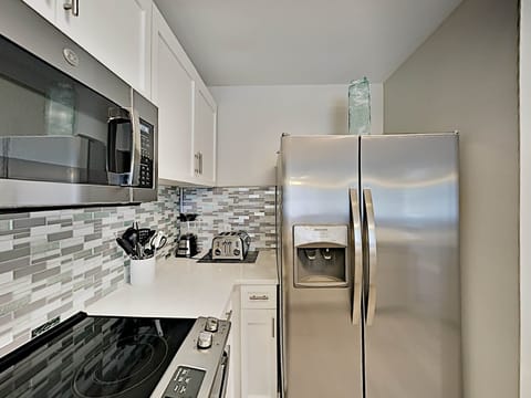 Condo, Multiple Beds, Balcony, Garden View (#1107 - No Pets Allowed) | Private kitchen | Fridge, microwave, oven, stovetop