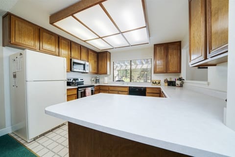 The kitchen is steps away from the living and dining