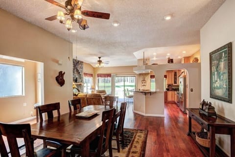 Large dining table with room for all, open to family room AND living room