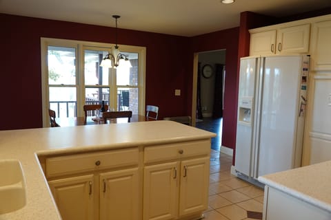 The breakfast nook overlooks the wraparound deck and river views.