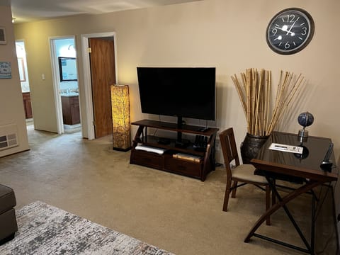 Living Room - LCD TV, desk w/chair, large sofa, AC/heater unit