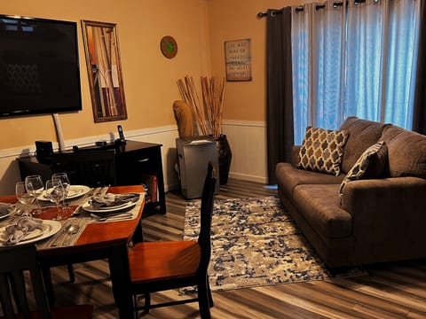 Family/Dining Room, table for 4, TV, desk w/chair, AC/heating unit, sofa