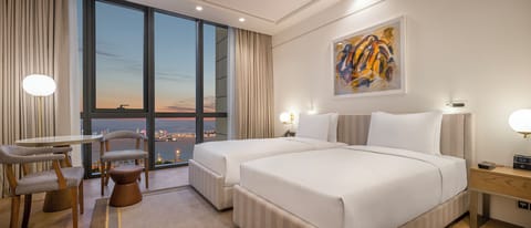 Premium bedding, down comforters, minibar, in-room safe