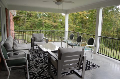 Covered back porch. Great for gathering and relaxing any time of the day.