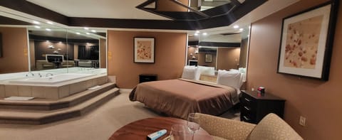 Deluxe Romantic Suite - Hot Tub & Fireplace | Down comforters, memory foam beds, individually decorated