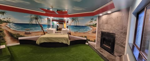 Hawaiian Paradise Romantic Suite with Hot Tub and Fireplace | Premium bedding, down comforters, memory foam beds