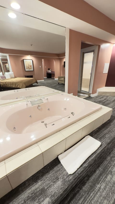 Honeymoon Suite with Hot Tub & Fireplace | Down comforters, memory foam beds, individually decorated