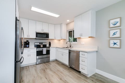 Renovated, clean and fully stocked kitchen with new appliances