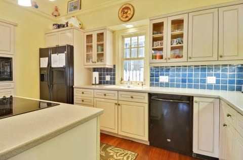 Spacious kitchen with modern appliances.