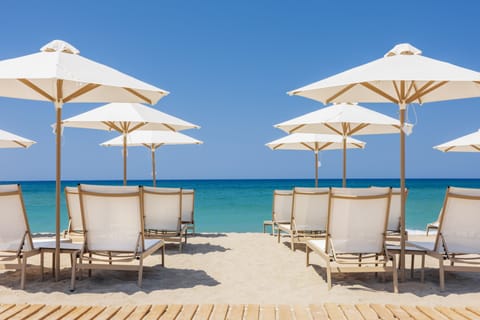 On the beach, sun loungers, beach umbrellas, beach towels