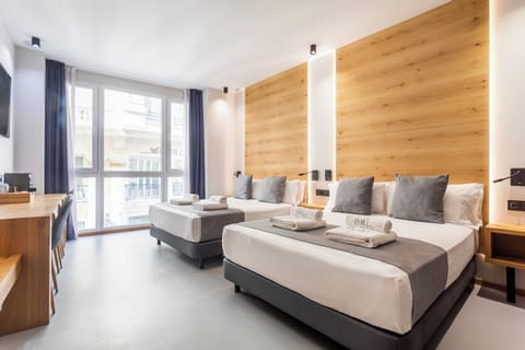 Deluxe Quadruple Room, City View | Premium bedding, down comforters, minibar, in-room safe