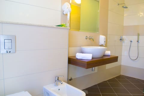 Shower, free toiletries, hair dryer, slippers