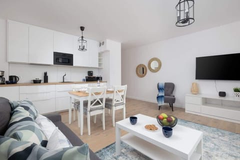 The living room featuring a sofa, which can be converted into a bed for two people.